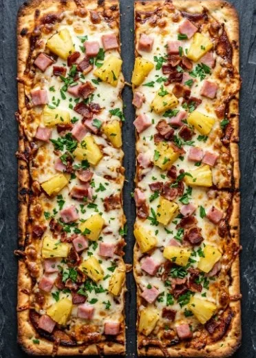 BBQ Hawaiian flatbread pizzas topped with pineapple and BBQ sauce