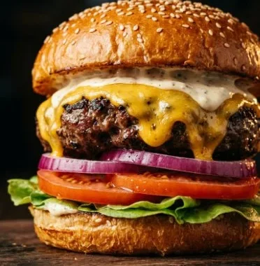 Perfect Burger 1 A perfectly cooked burger served with fresh toppings and a brioche bun.