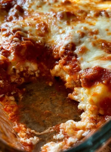 Delicious quick ravioli casserole topped with cheese and herbs