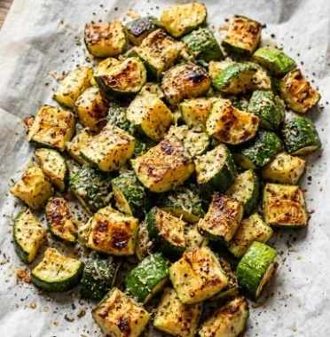 Crispy air fryer zucchini slices served on a plate