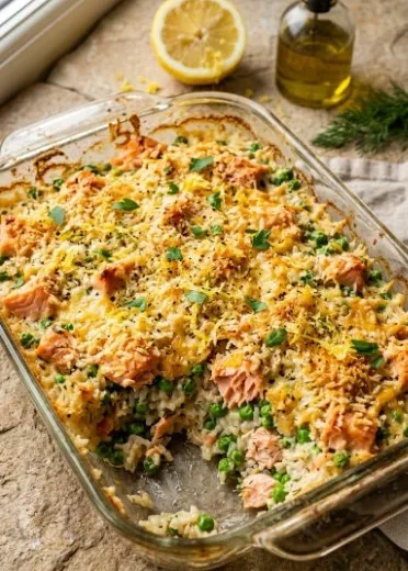 Delicious canned salmon casserole served in a dish with toppings