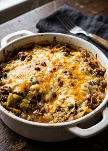 Creamed cabbage and ground beef casserole served in a baking dish