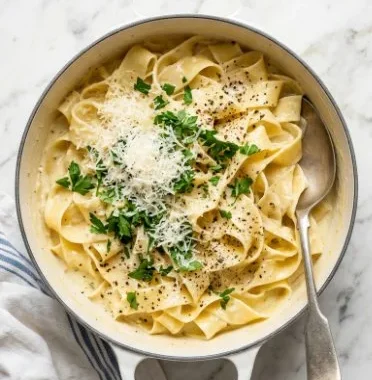 Creamy Lemon Pasta 2 Delicious creamy lemon pasta served in a bowl with fresh herbs.