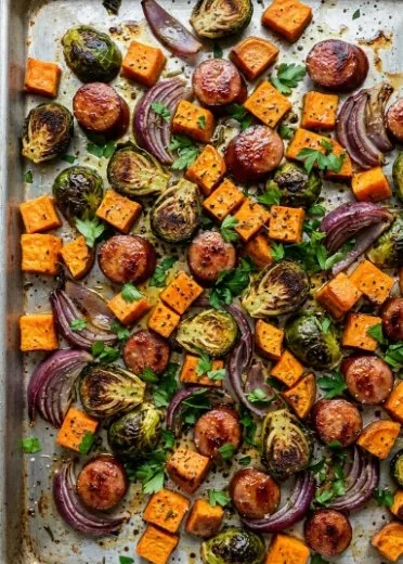 Easy sheet pan sausage with sweet potatoes and Brussels sprouts