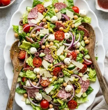 Hearty Italian Chopped Salad 2 A vibrant and hearty Italian chopped salad with fresh vegetables and herbs.