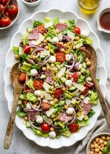 A vibrant and hearty Italian chopped salad with fresh vegetables and herbs.
