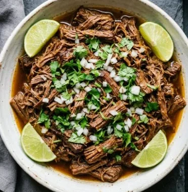 Delicious Mexican shredded beef cooked in a Crock Pot or Instant Pot.