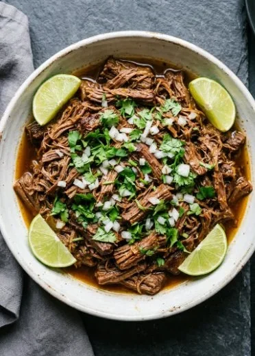 Delicious Mexican shredded beef cooked in a Crock Pot or Instant Pot.