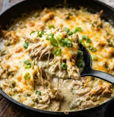 One pan dish of Keto Green Chili Chicken garnished with fresh herbs