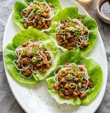 PF Chang's Chicken Lettuce Wraps 2 Plate of PF Chang's Chicken Lettuce Wraps with fresh ingredients