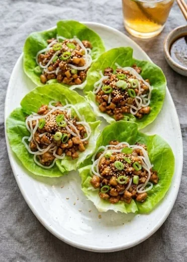 Plate of PF Chang's Chicken Lettuce Wraps with fresh ingredients