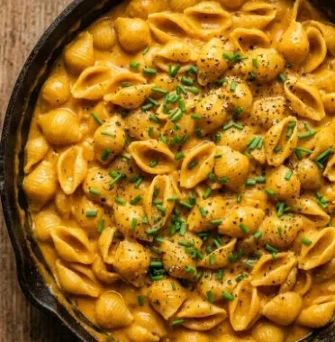 Pumpkin Mac and Cheese 1 Delicious bowl of Pumpkin Mac and Cheese topped with breadcrumbs and herbs