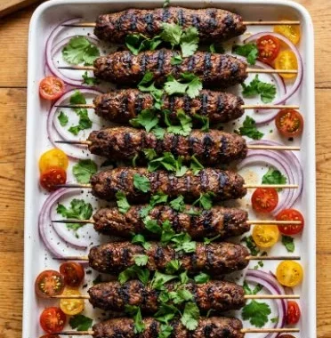 Sheet Pan Kebabs 2 Deliciously prepared sheet pan kebabs with colorful vegetables and spices.