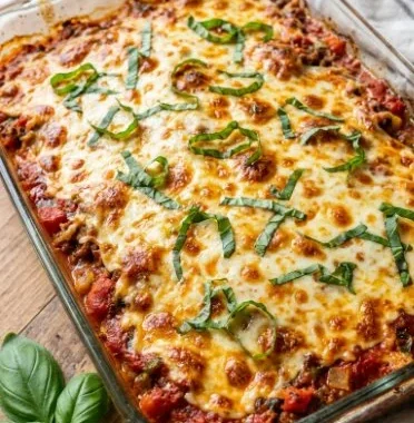 Baked Spaghetti Squash Pizza Casserole topped with cheese and fresh ingredients