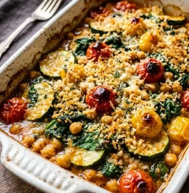 Spinach Zucchini Chickpea Bake 1 Spinach Zucchini Chickpea Bake served in a dish with fresh herbs