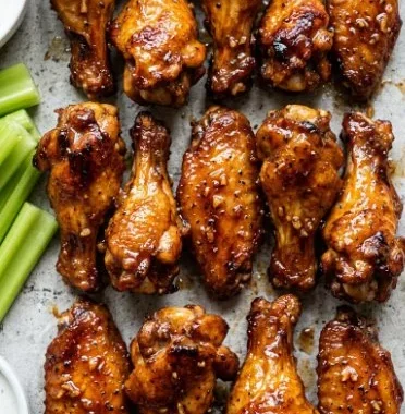 Sticky Honey Garlic Chicken Wings 1 Delicious sticky honey garlic chicken wings served with dipping sauce
