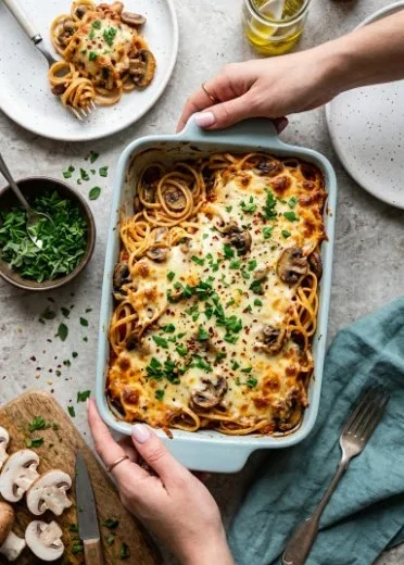 Creamy Turkey Tetrazzini casserole topped with breadcrumbs and cheese