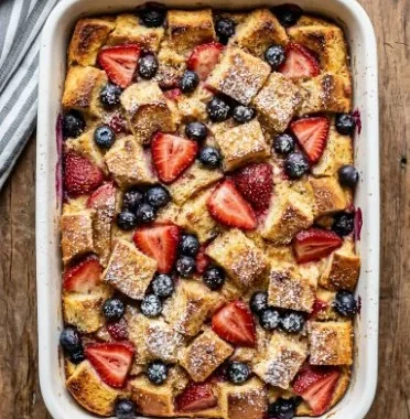 Berry French Toast Casserole 2 Delicious Berry French Toast Casserole with fresh berries and syrup