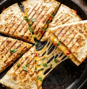 Cheese Quesadilla 1 Delicious cheese quesadilla served with salsa and guacamole