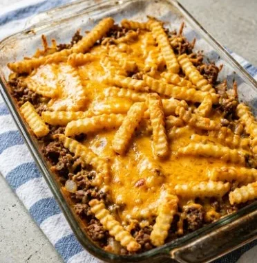 Cheeseburger French Fry Bake 2 Cheeseburger French fry bake topped with cheese and crispy fries