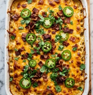 Creamy Keto Jalapeno Popper Chicken Casserole with cheese and jalapenos