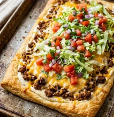 Taco pizza made with crescent rolls, ready in 30 minutes for a fun family meal.