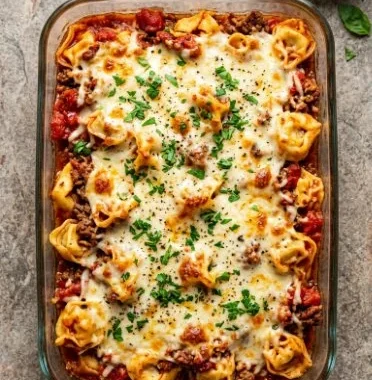 Dump and Bake Tortellini Casserole 1 Delicious Dump and Bake Tortellini Casserole ready to serve in a baking dish