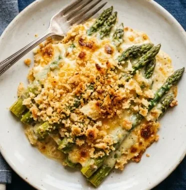 Easy asparagus casserole topped with breadcrumbs and cheese