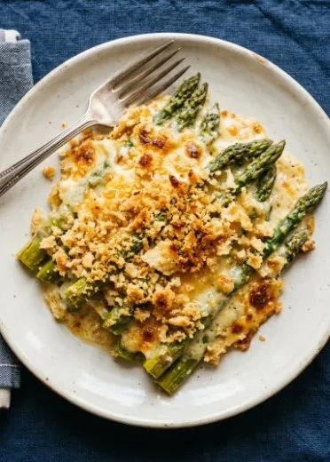 Easy asparagus casserole topped with breadcrumbs and cheese