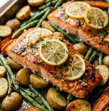 Lemon butter garlic salmon on a sheet pan with vegetables