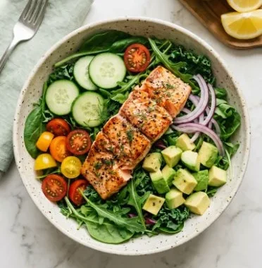 Fresh salmon power salad with greens and vegetables, healthy meal option