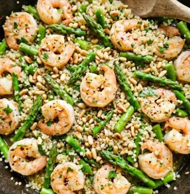 Garlic Butter Shrimp, Quinoa and Asparagus 2 Plate of Garlic Butter Shrimp served with quinoa and asparagus