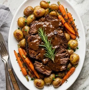 Grandma's Pot Roast 1 Delicious Grandma's pot roast served on a rustic table with vegetables and gravy.