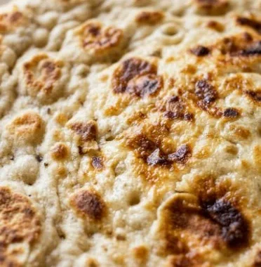 High protein cottage cheese flatbread made with 2 ingredients, served on a plate.