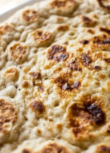 High protein cottage cheese flatbread made with 2 ingredients, served on a plate.