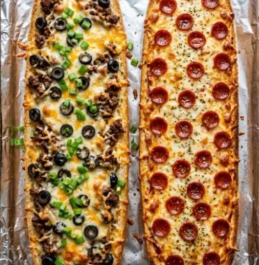 Homemade French Bread Pizza 1 Homemade French bread pizza topped with cheese and fresh ingredients