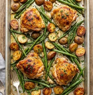 Parmesan Garlic Chicken Thighs with Potatoes and Green Beans 1 Parmesan Garlic Chicken thighs with potatoes and green beans on a plate