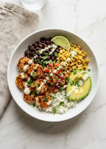 Colorful shrimp taco bowls with fresh toppings, a healthy meal option
