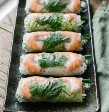 Simple Summer Rolls with Shrimp 1 Fresh and delicious summer rolls with shrimp served on a plate