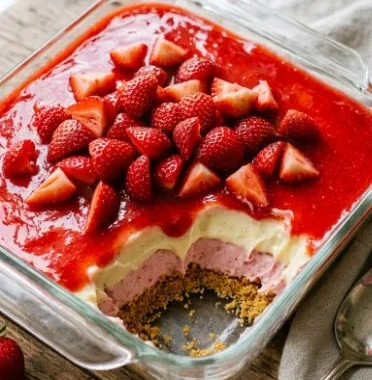 Delicious strawberry pudding delight served in a bowl with fresh strawberries on top