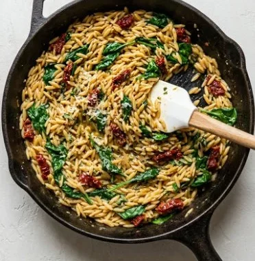 Sun-Dried Tomato Chicken and Orzo 1 Delicious Sun-Dried Tomato Chicken served with orzo pasta
