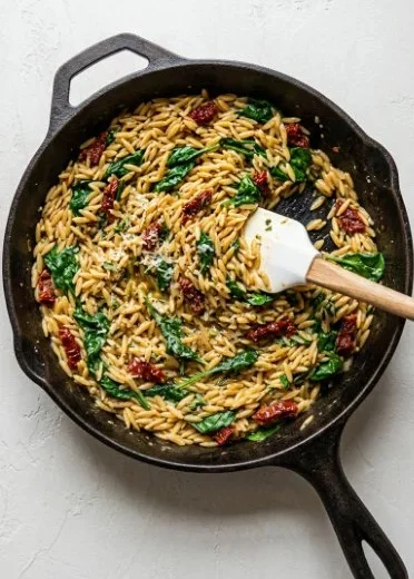 Delicious Sun-Dried Tomato Chicken served with orzo pasta