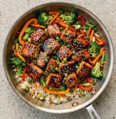 The Best Teriyaki Salmon Stir Fry 2 Delicious teriyaki salmon stir fry served with colorful vegetables