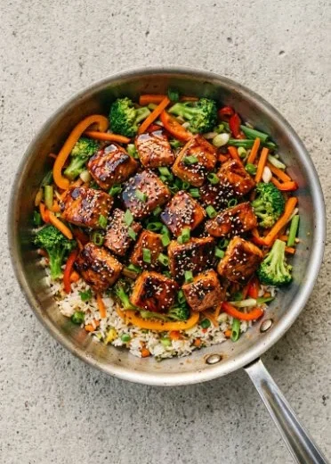 Delicious teriyaki salmon stir fry served with colorful vegetables