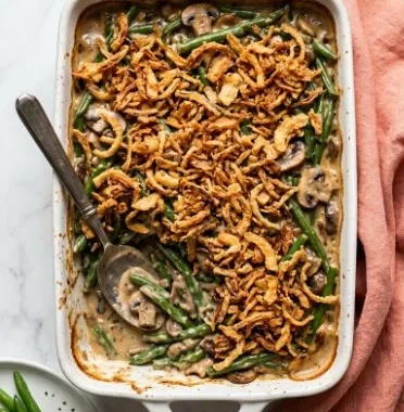 Vegan Green Bean Casserole 1 Vegan green bean casserole topped with crispy onions and mushrooms