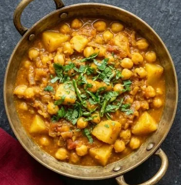 Vegan Potato and Chickpea Curry 1 Delicious vegan potato and chickpea curry served in a bowl