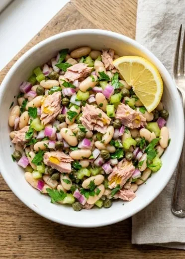 White bean salad with tuna served in a bowl, healthy and delicious meal option.