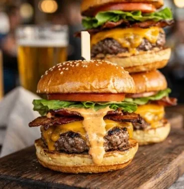 Bacon Cheeseburger Sliders 1 Delicious bacon cheeseburger sliders served on a platter