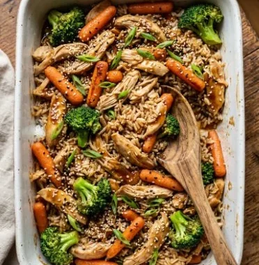 Delicious teriyaki chicken casserole topped with green onions and sesame seeds