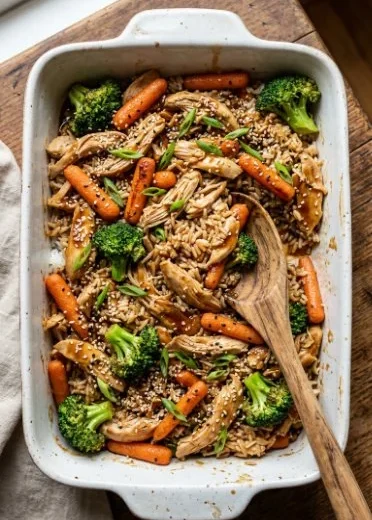 Delicious teriyaki chicken casserole topped with green onions and sesame seeds